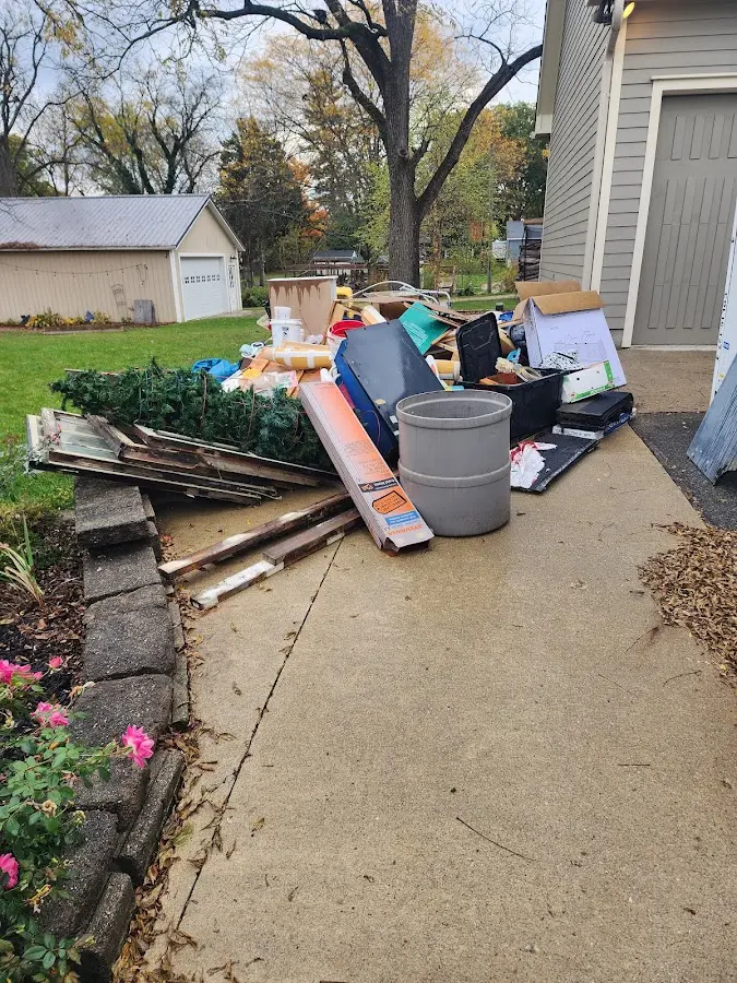 Dumpster being loaded with debris for Estate Cleanout Dumpster Rental in Berryville